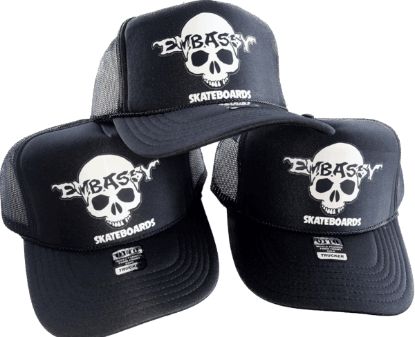 black trucker cap white skully print